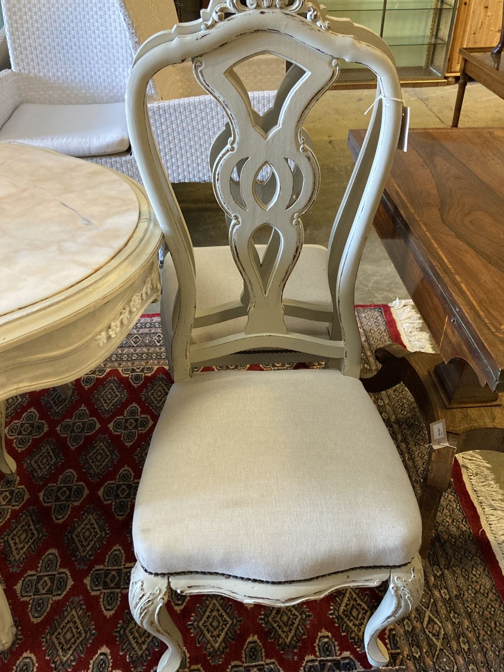 A Louis XV-style cream painted dining table, width 204cm, depth 90cm, height 76cm and six chairs